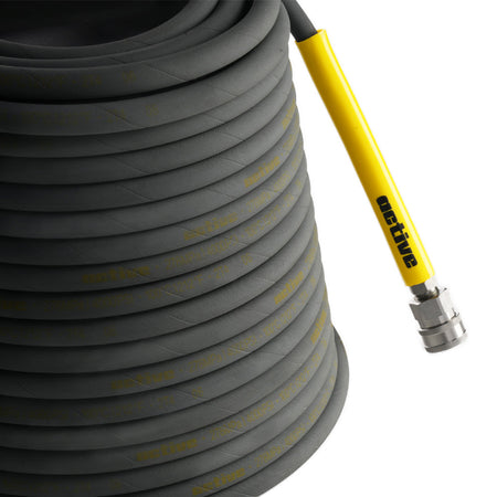 The Active™ 50’ Pressure Washer Extension Hose – 5/16 from Active Products Inc. is a coiled grey hose with a yellow connector and a metal fitting at the end. The "Active" branded connector features secure 304 stainless steel quick connects.