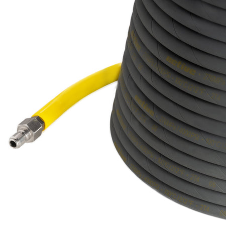 The Active™ 50’ Pressure Washer Extension Hose – 5/16 from Active Products Inc. is depicted. This coiled black hose with a gray surface and a yellow stripe boasts a durable steel braided construction for long-lasting use. It comes with a metal fitting at one end, extending outward from the coil to connect to other equipment or pipelines.