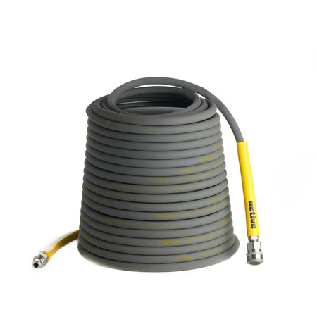 A coiled grey hose with a yellow connector end, optimized for Active pressure washers and featuring durable steel braided construction, is pictured on a white background. The Active™ 50’ Pressure Washer Extension Hose – 5/16 by Active Products Inc. is neatly wound into multiple layers.